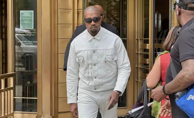 Ye, the rapper formerly known as Kanye West, leaves federal court during the trial of Sean "Diddy" Combs in New York, Friday, June 13, 2025. (AP Photo/Michael R. Sisak)