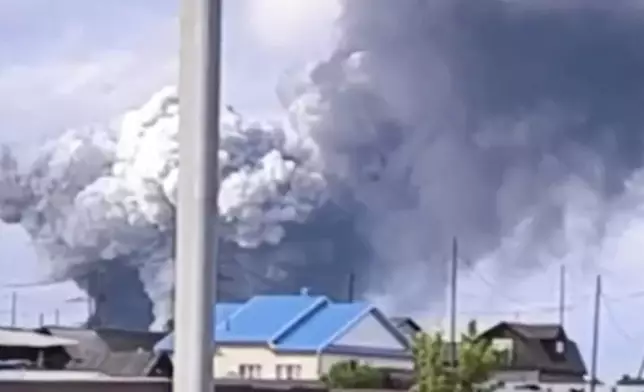 In this photo released by Governor of Irkutsk region Igor Kobzev telegram channel on Sunday, June 1, 2025, plumes of smoke are seen rising over the Belaya air base in the Irkutsk region in eastern Siberia after a Ukrainian drone attack in the Irkutsk region, more than 4,000 kilometers (2,500 miles) from Ukraine. (Governor of Irkutsk region Igor Kobzev telegram channel via AP)