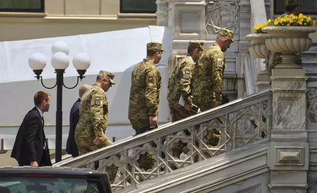 Members of the Ukrainian delegation arrive at the Ciragan Palace for Ukraine-Russia peace talks in Istanbul, Turkey, Monday, June 2, 2025. (AP Photo/Emrah Gurel)