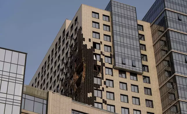 A multi-storey building is seen damaged by a Russian drone strike on Kyiv, Ukraine, Tuesday, June 10, 2025. (AP Photo/Evgeniy Maloletka)