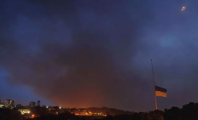 Smoke rises after Russian drone strike on Kyiv, Ukraine, Tuesday, June 10, 2025. (AP Photo/Evgeniy Maloletka)