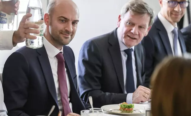 France's Minister for Europe and Foreign Affairs Jean-Noel Barrot, left, and Germany's Foreign Minister Johann Wadephul attend a work lunch at the offices of the honorary Consul of the Federal Republic of Germany in Geneva, Friday, June 20, 2025. (Fabrice Coffrini/Keystone via AP)