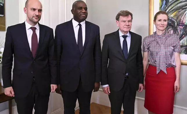France's Minister for Europe and Foreign Affairs Jean-Noel Barrot, from left, Britain's Foreign Secretary David Lammy, Germany's Foreign Minister Johann Wadephul and European Union High Representative for Foreign Affairs and Security Policy, Kaja Kallas, pose for photographs in the offices of the honorary Consul of the Federal Republic of Germany in Geneva, Friday, June 20, 2025. (Fabrice Coffrini/Keystone via AP)