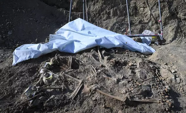 Hhuman remains believed to belong to prisoners executed during or after Greece's 1946-49 Civil War are seen in Thessaloniki, northern Greece, Saturday, June 7, 2025. (AP Photo/Giannis Papanikos)