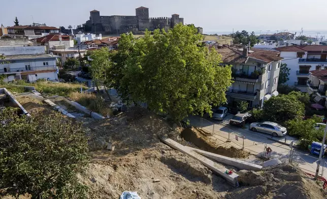 The site where excavation works unearthed human remains believed to belong to dozens of prisoners executed during or after Greece's 1946-49 Civil War, is seen in Thessaloniki, northern Greece, Saturday, June 7, 2025. (AP Photo/Giannis Papanikos)