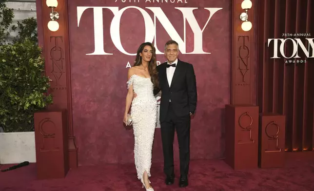 Amal Clooney, left, and George Clooney arrive at the 78th Tony Awards on Sunday, June 8, 2025, at Radio City Music Hall in New York. (Photo by Evan Agostini/Invision/AP)
