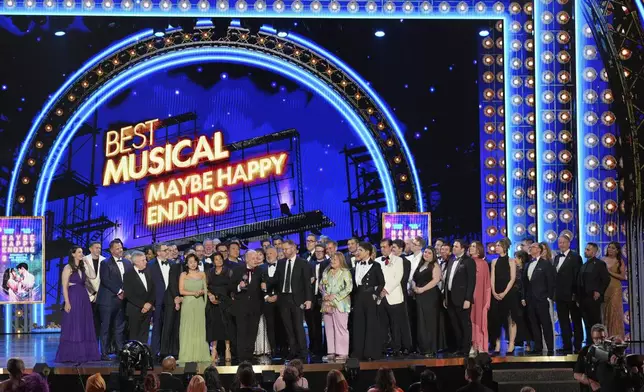 The cast and crew of "Maybe Happy Ending" accept the award for best musical for during the 78th Tony Awards on Sunday, June 8, 2025, at Radio City Music Hall in New York. (Photo by Charles Sykes/Invision/AP)