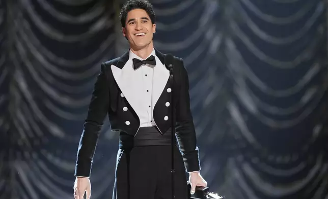 Darren Criss accepts the award for best performance by an actor in a leading role in a musical for "Maybe Happy Ending" during the 78th Tony Awards on Sunday, June 8, 2025, at Radio City Music Hall in New York. (Photo by Charles Sykes/Invision/AP)