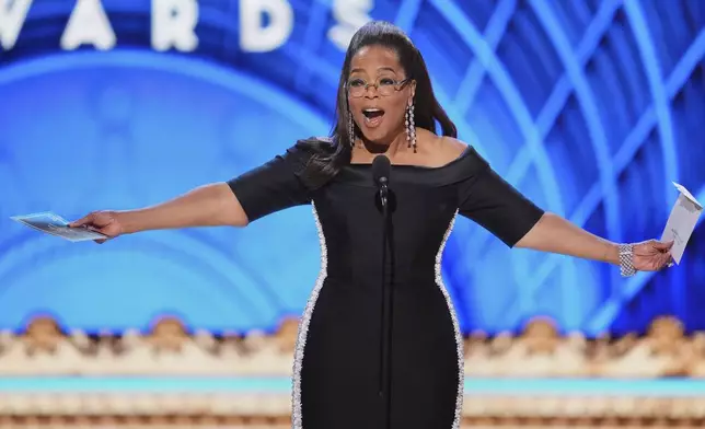 Oprah Winfrey presents the award for best performance by an actress in a leading role in a musical during the 78th Tony Awards on Sunday, June 8, 2025, at Radio City Music Hall in New York. (Photo by Charles Sykes/Invision/AP)