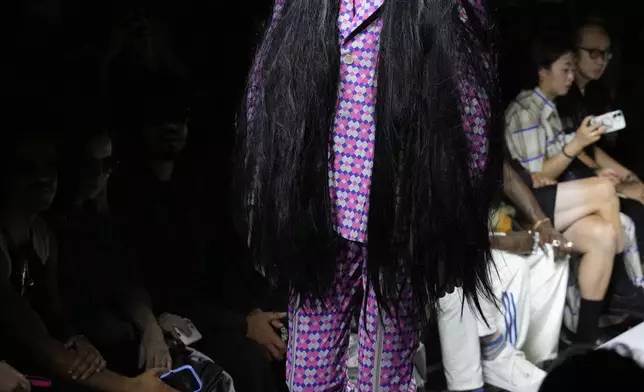 A model wears a creation part of the men's Comme des Garcons Homme Plus Spring-Summer 2026 collection, that was presented in Paris Friday, June 27, 2025. (AP Photo/Michel Euler)