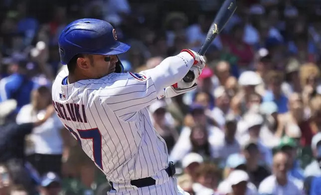 Chicago Cubs' Seiya Suzuki, of Japan, hits a solo home run during the first inning of a baseball game against the Seattle Mariners in Chicago, Sunday, June 22, 2025. (AP Photo/Nam Y. Huh)