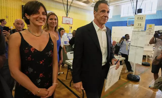 New York mayoral candidate, former N.Y. Gov. Andrew Cuomo, carries his ballot to vote in the Democrat mayoral primary election in New York, Tuesday, June 24, 2025. (AP Photo/Richard Drew)