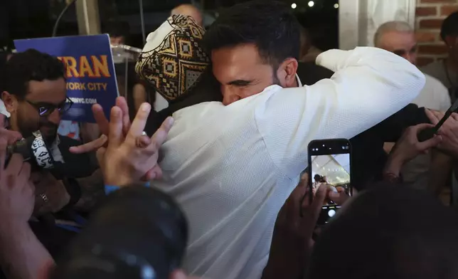 Democratic mayoral candidate Zohran Mamdani hugs supporters after speaking at his primary election party, Wednesday, June 25, 2025, in New York. (AP Photo/Heather Khalifa)