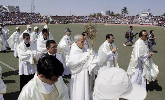 FILE - Pope Leo XIV, then Apostolic Administrator of Chiclayo Robert Prevost, attends a Corpus Christi celebration at a stadium in Chiclayo, Peru, Friday, June 19, 2015. (AP Photo/Julio Reano, File)