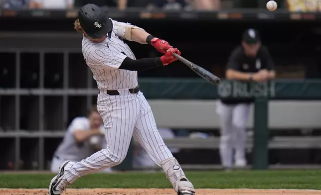 Chicago White Sox's Chase Meidroth (10) hits a home run during the third inning of a baseball game against the Kansas City Royals, Saturday, June 7, 2025, in Chicago. (AP Photo/Erin Hooley)