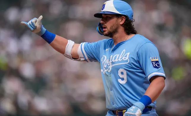 Kansas City Royals' Vinnie Pasquantino (9) gestures to the dugout after hitting a single during the fourth inning of a baseball game against the Chicago White Sox, Saturday, June 7, 2025, in Chicago. (AP Photo/Erin Hooley)