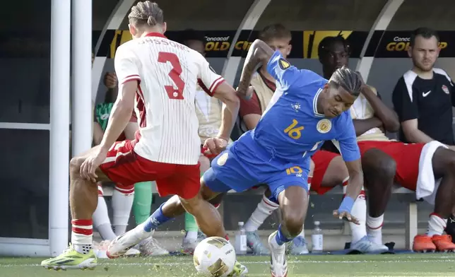 Canada's Zorhan Bassong (3) blocks the attempted steal by Curacao Jearl Margaritha (16) during a CONCACAF Gold Cup soccer match Saturday, June 21, 2025, in Houston, Texas. (AP Photo/Michael Wyke)