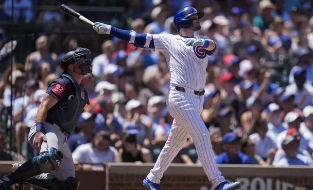 Chicago Cubs' Ian Happ (8) hits a three-run home run during the second inning of a baseball game against the Seattle Mariners, Saturday, June 21, 2025, in Chicago. (AP Photo/Erin Hooley)