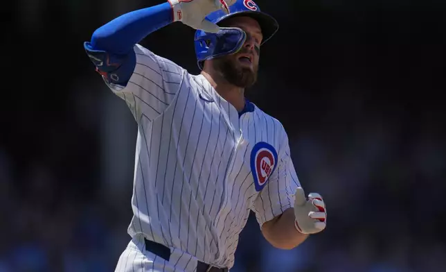 Chicago Cubs' Michael Busch runs the bases after hitting a three-run home run during the third inning of a baseball game against the Seattle Mariners, Saturday, June 21, 2025, in Chicago. (AP Photo/Erin Hooley)