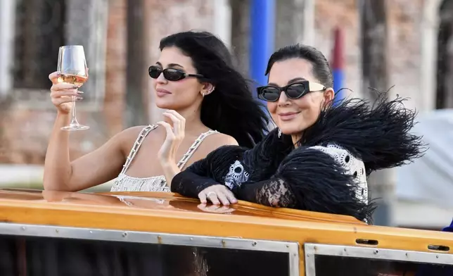 Kylie Jenner, left, and Kriss Jenner leave a hotel during celebrations for Jeff Bezos and Lauren Sanchez Bezos' wedding, in Venice, Saturday, June 28, 2025. (AP Photo/Luigi Costantini)