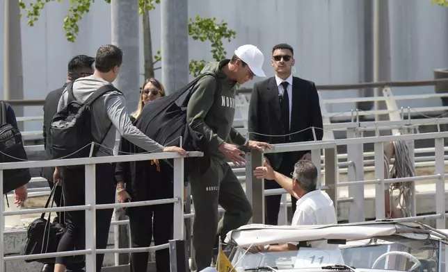 Former NFL quarterback Tom Brady, center, arrives for the weekend wedding of Amazon founder Jeff Bezos and Lauren Sanchez, in Venice, Italy, Thursday, June 26, 2025. (AP Photo/Luca Bruno)