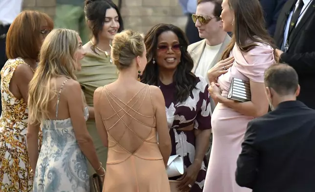 Oprah Winfrey, center right, arrives in Venice, Italy, Thursday, June 26, 2025, ahead of Jeff Bezos' wedding. (AP Photo/Luigi Costantini)