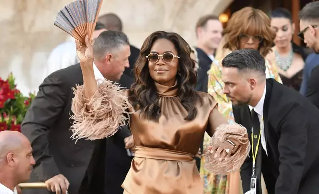 Oprah Winfrey leaves a hotel during celebrations for Jeff Bezos and Lauren Sanchez Bezos' wedding, in Venice, Saturday, June 28, 2025. (AP Photo/Luigi Costantini)