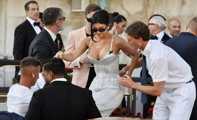 Kylie Jenner leaves a hotel ahead of the anticipated wedding celebrations of Jeff Bezos and Lauren Sanchez, in Venice, Italy, Friday, June 27, 2025. (AP Photo/Luigi Costantini)