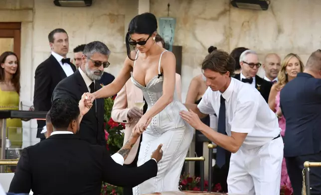 Kylie Jenner leaves a hotel ahead of the anticipated wedding celebrations of Jeff Bezos and Lauren Sanchez, in Venice, Italy, Friday, June 27, 2025. (AP Photo/Luigi Costantini)
