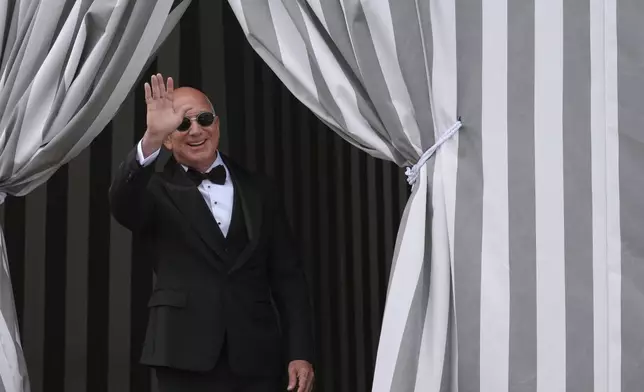 Jeff Bezos leaves a hotel ahead of the anticipated wedding celebrations with Lauren Sanchez, in Venice, Italy, Friday, June 27, 2025. (AP Photo/Antonio Calanni)