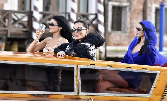 From left, Kylie Jenner, Kriss Jenner and Kendall Jenner leave a hotel during celebrations for Jeff Bezos and Lauren Sanchez Bezos' wedding, in Venice, Saturday, June 28, 2025. (AP Photo/Luigi Costantini)