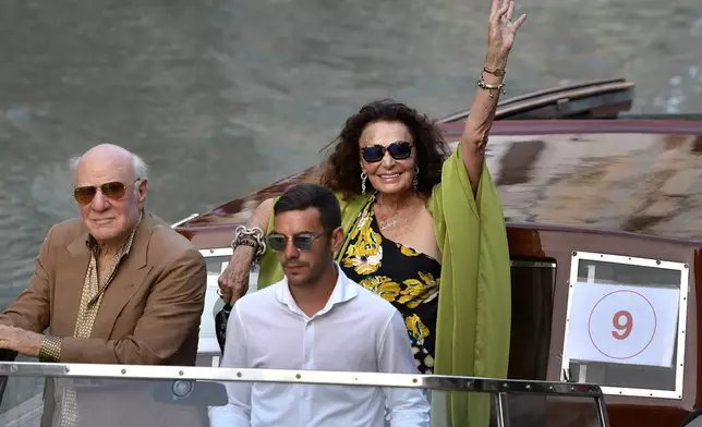 Barry Diller, left, and Diane von Furstenberg arrive in Venice, Italy, Thursday, June 26, 2025, ahead of Jeff Bezos' wedding. (AP Photo/Luigi Costantini)
