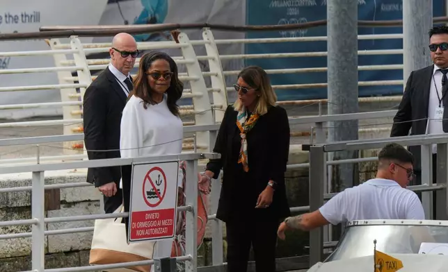 Oprah Winfrey, second left, arrives for the weekend wedding of Amazon founder Jeff Bezos and Lauren Sanchez, in Venice, Italy, Thursday, June 26, 2025. (AP Photo/Luca Bruno)