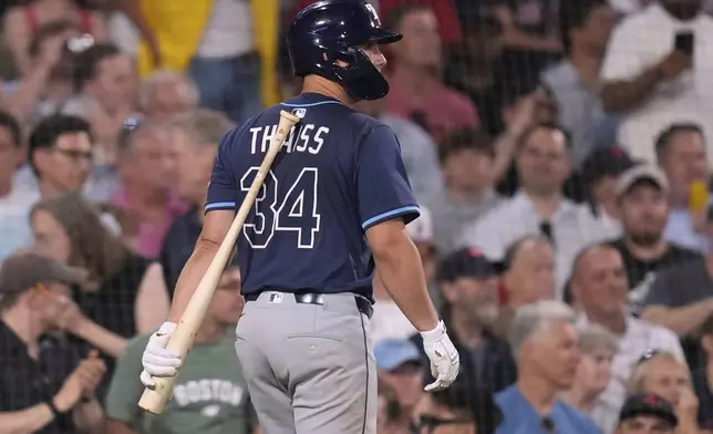 Tampa Bay Rays' Matt Thaiss heads back to the dugout after striking out against Boston Red Sox pitcher Greg Weissert, which ended the top of the eighth inning, during a baseball game at Fenway Park, Wednesday, June 11, 2025, in Boston. (AP Photo/Charles Krupa)