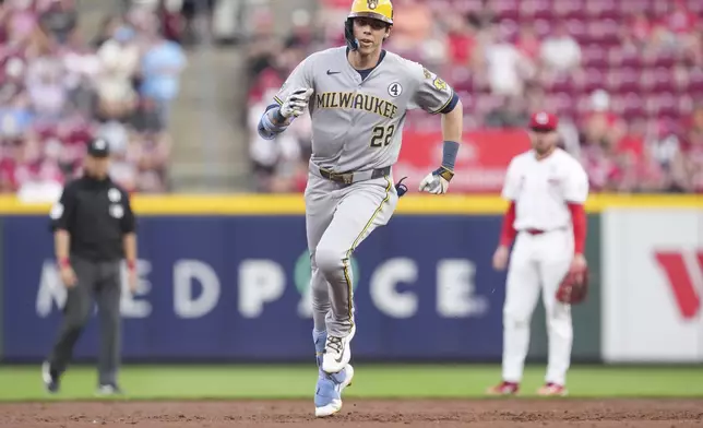 Milwaukee Brewers' Christian Yelich rounds the bases after hitting solo home run during the third inning of a baseball game against the Cincinnati Reds, Monday, June 2, 2025, in Cincinnati. (AP Photo/Jeff Dean)