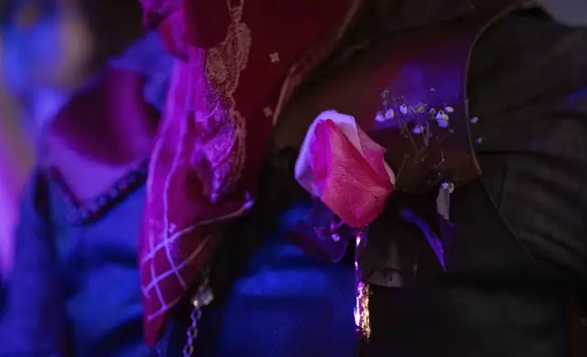 Lennon Sandoval wears a boutonnière that their mom made for them and their date during a "Pink Pony Prom" held to celebrate teen and young adult members of the LGBTQ+ community on Friday, May 30, 2025, in Portland, Ore. (AP Photo/Jenny Kane)
