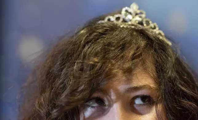 Jason Schubert wears a tiara during a "Pink Pony Prom" on Friday, May 30, 2025, in Portland, Ore. (AP Photo/Jenny Kane)