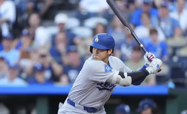 Los Angeles Dodgers' Shohei Ohtani gets ready to bat before hitting a solo home run during the first inning of a baseball game against the Kansas City Royals, Friday, June 27, 2025, in Kansas City, Mo. (AP Photo/Charlie Riedel)