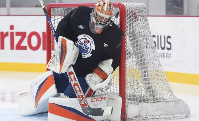 Edmonton Oilers goaltender Stuart Skinner makes a save during practice at the NHL Stanley Cup Finals in Fort Lauderdale, Fla., Tuesday, June 10, 2025.(Nathan Denette/The Canadian Press via AP)