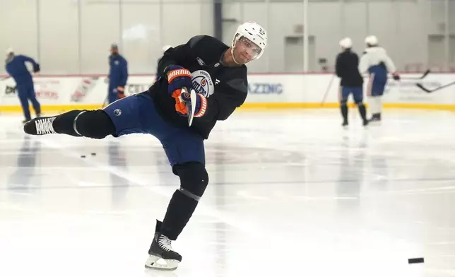 Edmonton Oilers defenceman Darnell Nurse warms up during practice at the NHL Stanley Cup Finals in Fort Lauderdale, Fla., Tuesday, June 10, 2025.(Nathan Denette/The Canadian Press via AP)