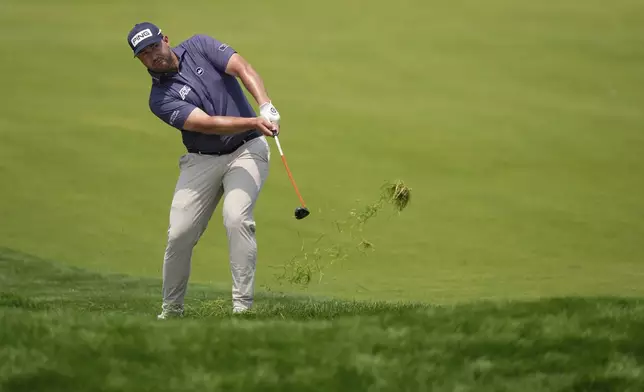 Thriston Lawrence, of South Africa, hits from the 18th fairway during the first round of the U.S. Open golf tournament at Oakmont Country Club Thursday, June 12, 2025, in Oakmont, Pa. (AP Photo/Charlie Riedel)
