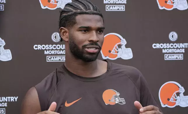 Cleveland Browns quarterback Shedeur Sanders (12) answers a question during a news conference at NFL football minicamp in Berea, Ohio, Tuesday, June 10, 2025. (AP Photo/Sue Ogrocki)