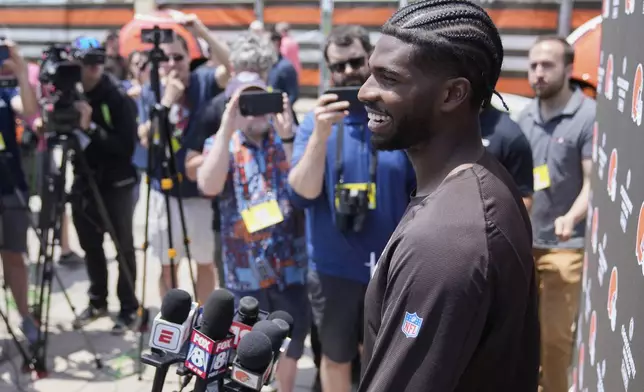 Cleveland Browns quarterback Shedeur Sanders (12) answers a question during a news conference at NFL football minicamp in Berea, Ohio, Tuesday, June 10, 2025. (AP Photo/Sue Ogrocki)