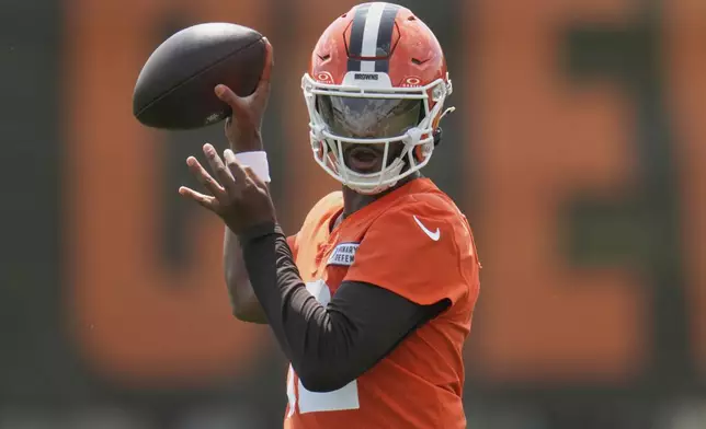 Cleveland Browns quarterback Shedeur Sanders (12) throws during practice at NFL football minicamp in Berea, Ohio, Tuesday, June 10, 2025. (AP Photo/Sue Ogrocki)