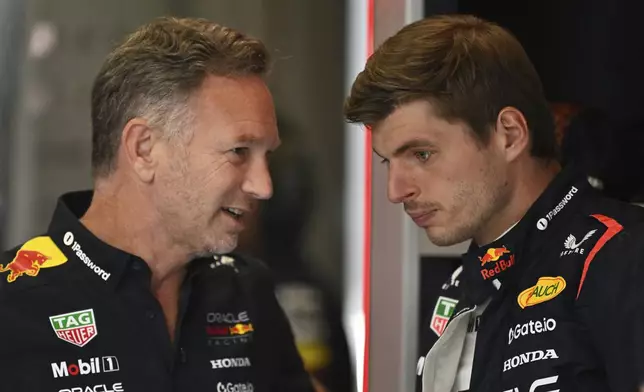 Red Bull team principal Christian Horner talkks to Red Bull driver Max Verstappen of the Netherlands before the third free practice at the Red Bull Ring racetrack, ahead of the Austrian Formula One Grand Prix in Spielberg, Austria, Saturday, June 28, 2025. (AP Photo/Denes Erdos)
