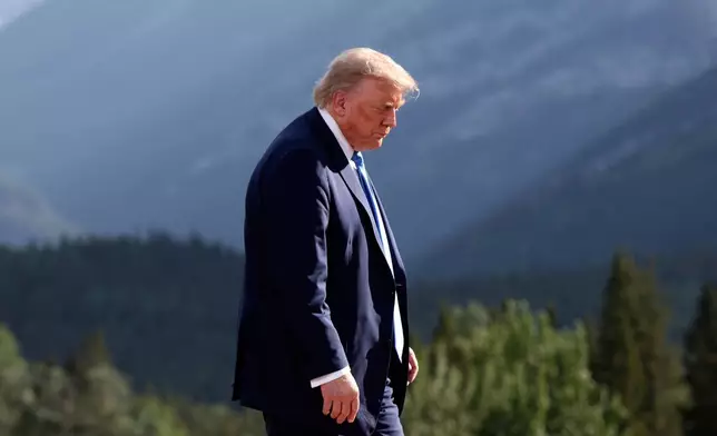 U.S. President Donald Trump leaves after a family photo session during the G7 Summit, in Kananaskis, Alberta, Monday, June 16, 2025. (Suzanne Plunkett/Pool Photo via AP)