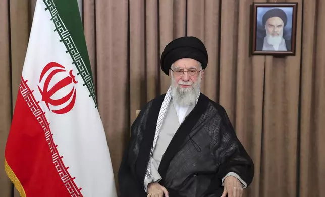 This photo released by an official website of the office of the Iranian supreme leader, shows Supreme Leader Ayatollah Ali Khamenei in a televised speech, under a portrait of the late revolutionary founder Ayatollah Khomeini, Friday, June 13, 2025. (Office of the Iranian Supreme Leader via AP)