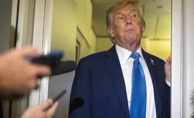 President Donald Trump speaks with reporters while flying aboard Air Force One en route from Calgary, Canada to Joint Base Andrews, Md., late Monday, June 16, 2025. (AP Photo/Mark Schiefelbein)