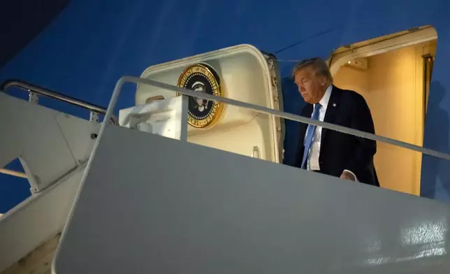 President Donald Trump steps off Air Force One after at Joint Base Andrews, Md., on Tuesday, June 17, 2025, after returning from Calgary, Canada and the G7 Summit. (AP Photo/Mark Schiefelbein)