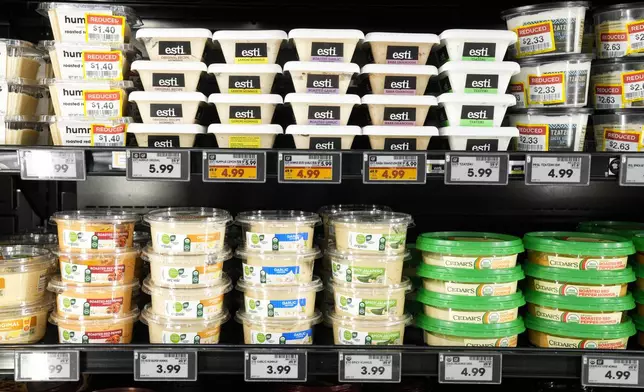 Electronic grocery labels are displayed at a Kroger grocery store, in Monroe, Ohio, Nov. 13, 2024. (AP Photo/Jeff Dean)